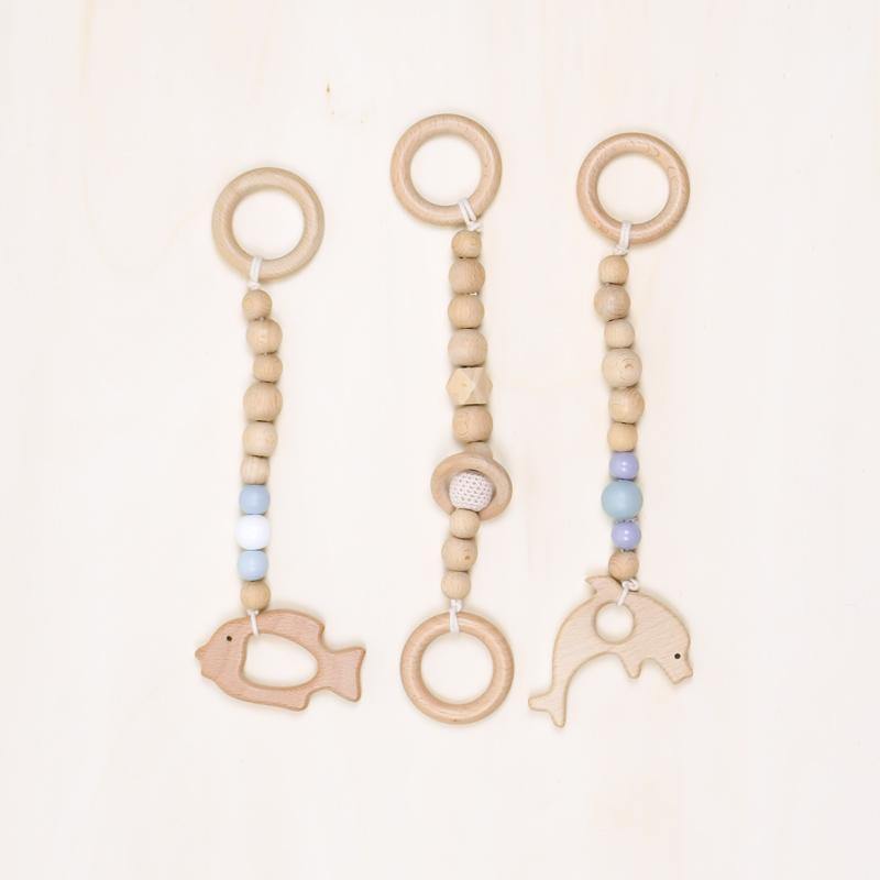 three wooden rattles for baby gym